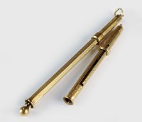 Lot 127 - A 9ct gold swizel stick, together with a 9ct...