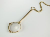 Lot 129 - A pair of gold plated lorgnettes, suspended...
