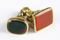 Lot 132 - A carnelian set fob, together with a similar...