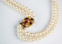 Lot 137 - A two strand uniform cultured pearl collarette,...