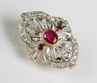 Lot 139 - A diamond and ruby brooch, designed as a...