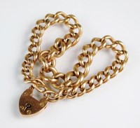 Lot 155 - A yellow metal curb link bracelet, the heart...