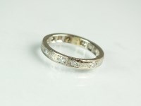Lot 169 - A diamond set eternity ring, the white metal...