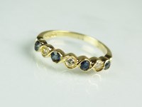 Lot 170 - An 18ct yellow gold seven stone sapphire and...