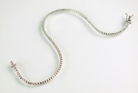 Lot 187 - A diamond tennis bracelet, the row of...