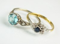 Lot 190 - A three stone blue zircon and diamond ring,...