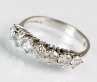 Lot 192 - An 18ct white gold seven stone diamond ring,...