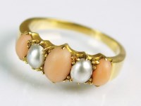 Lot 222 - A five stone graduated coral and split pearl...