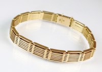 Lot 225 - A rose metal seven bar gate link bracelet,...