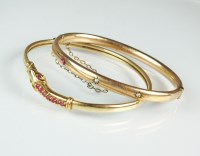 Lot 226 - A 9ct gold ruby set snake bangle, weight 7.6g,...