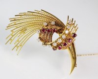 Lot 227 - A ruby and diamond spray brooch, designed as...