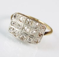 Lot 233 - A diamond set panel ring, designed as three...