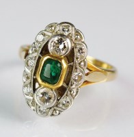 Lot 234 - An emerald and diamond oval cluster ring,...