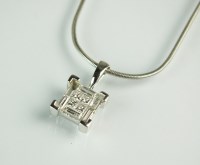 Lot 237 - An 18ct white gold diamond set pendant,...