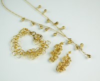 Lot 240 - A 9ct yellow gold beaded drop necklace,...