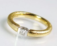 Lot 242 - An 18ct gold single stone diamond ring, the...