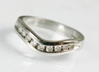 Lot 245 - A platinum diamond set band, the herringbone...