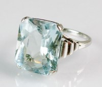 Lot 258 - A single stone aquamarine dress ring, the...