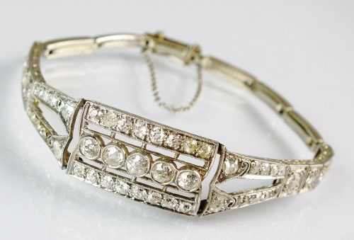 Lot 260 - A stylised Art Deco diamond set bracelet,...