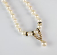Lot 274 - A single strand cultured pearl, diamond and...