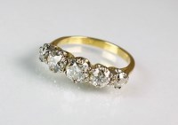 Lot 278 - A five stone graduated diamond ring, the...