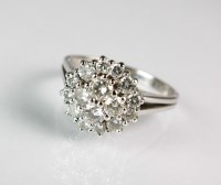 Lot 283 - A diamond cluster ring, designed as a central...