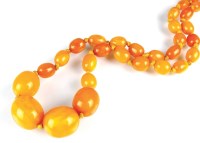 Lot 298 - A single strand graduated amber necklace, the...