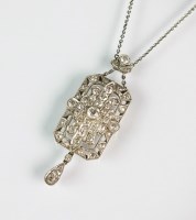 Lot 301 - An Art Deco diamond panel pendant, designed as...