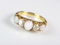 Lot 306 - A five stone opal and diamond ring, designed a...