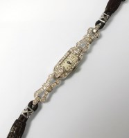 Lot 312 - A Lady's white metal diamond set Monroe...