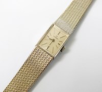 Lot 318 - A Lady's 18ct white gold Omega bracelet watch,...