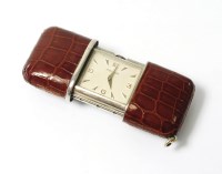 Lot 339 - A Lady's Movado steel and chrome purse watch,...