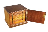Lot 617 - A sixteen drawer wood coin cabinet, measuring...