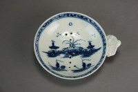 Lot 161 - A Caughley egg drainer painted with the Island...