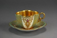 Lot 202 - A Coalport jewelled quatrefoil cabinet cup and...