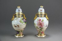 Lot 213 - A pair of rare Coalport vases and covers...