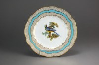 Lot 216 - A Coalport plate painted with a parrot perched...