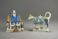 Lot 243 - A 19th century prattware money box formed as a...