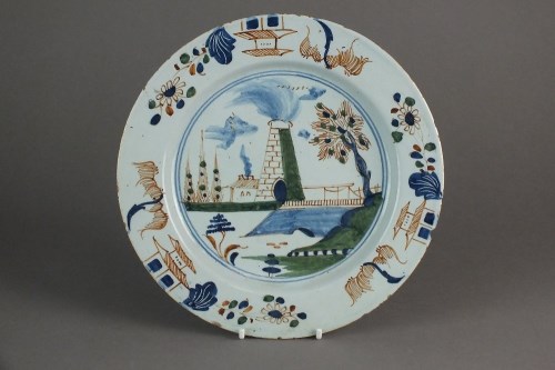Lot 250 - A London delft plate, attributed to Vauxhall,...