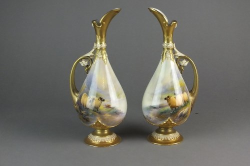 Lot 254 - A pair of Royal Worcester ewers painted with...
