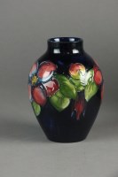 Lot 286 - A Moorcroft vase in the Clematis pattern...