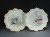 Lot 295 - A pair of Doulton Burslem lobed plates painted...