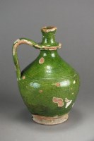 Lot 309 - A medieval green glazed stoneware wine jug...