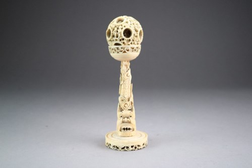 Lot 447 - A Chinese Canton ivory puzzle ball on stand,...