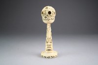 Lot 447 - A Chinese Canton ivory puzzle ball on stand,...