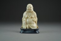 Lot 450 - A Chinese carved ivory figure of a laughing...