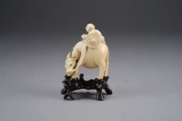 Lot 462 - A small Chinese ivory figure of a Confucian...