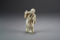 Lot 481 - A Japanese ivory okimono of a rakan, Meiji...