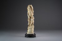 Lot 483 - A Japanese ivory okimono of an immortal,...