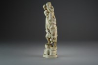 Lot 491 - A Japanese marine ivory okimono of a farmer...